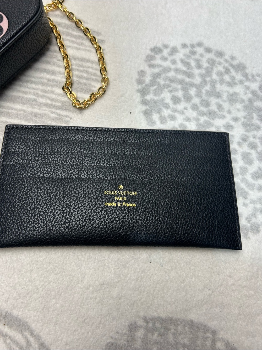 Pink and black purse with long chain and wallet
